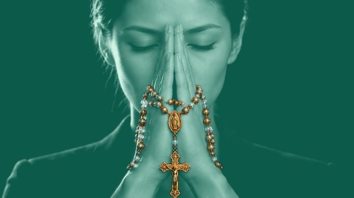Woman 3 of 13 in prayer, wearing Rosario N°01