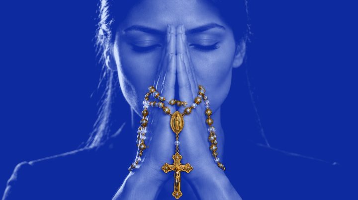 Woman 8 of 13 in prayer, wearing Rosario N°01