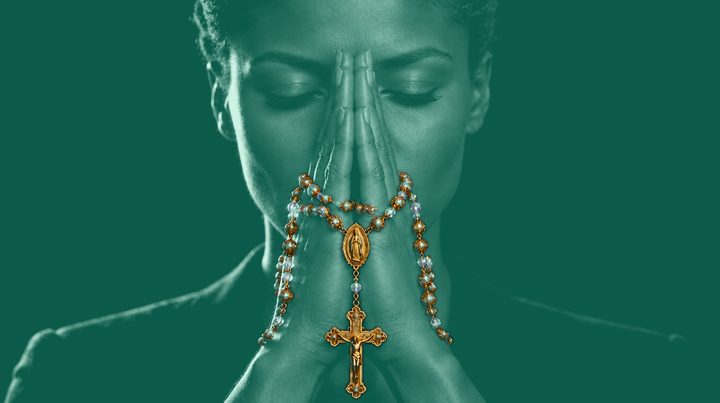 Woman 9 of 13 in prayer, wearing Rosario N°01